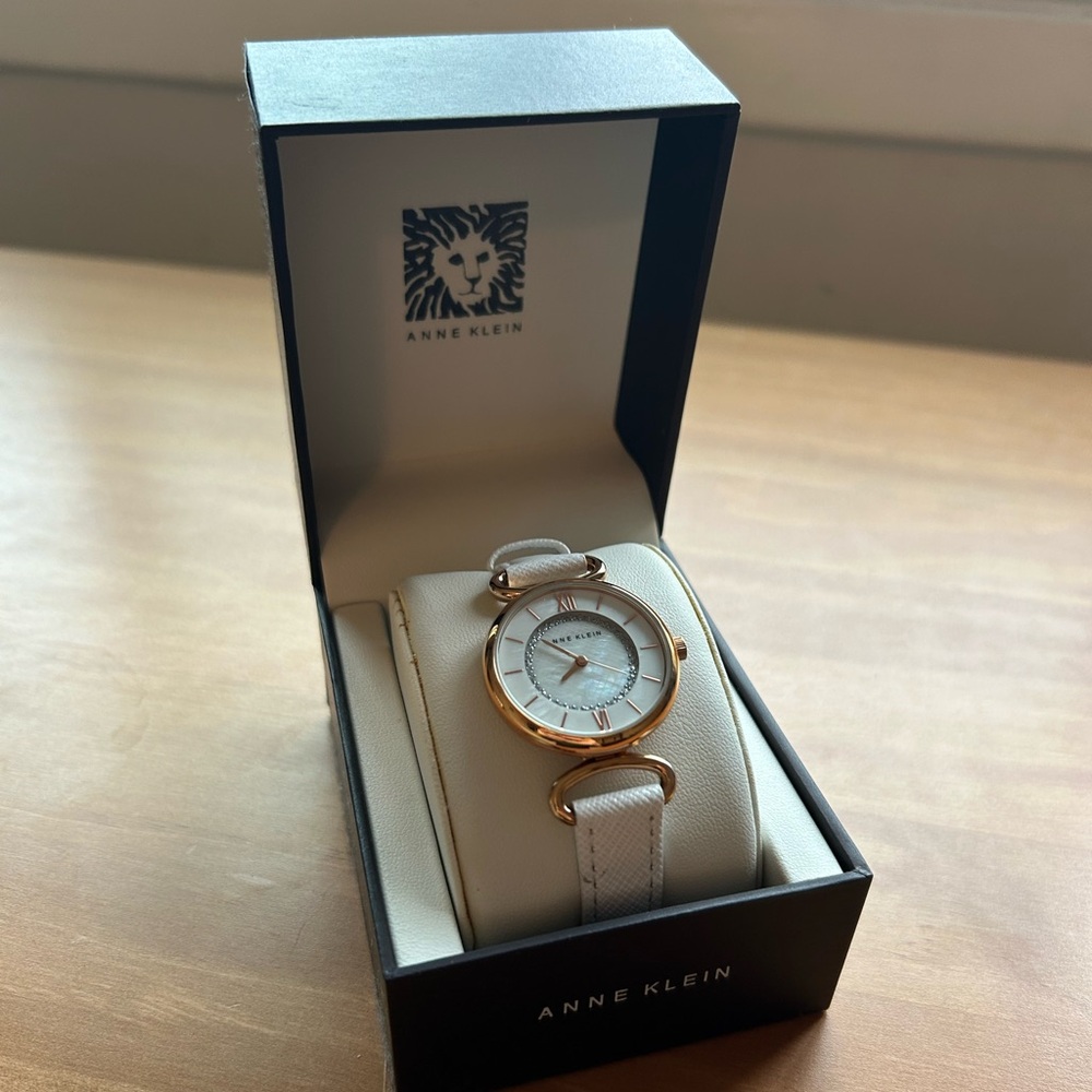 Anna Klein women’s gold tone round white leather strap watch